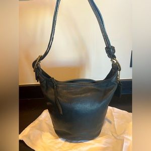 Coach Bleecker #11422 crossbody saddle bag in dark green with tattersall lining.